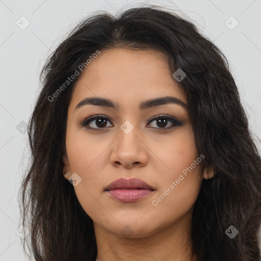 Joyful latino young-adult female with long  brown hair and brown eyes