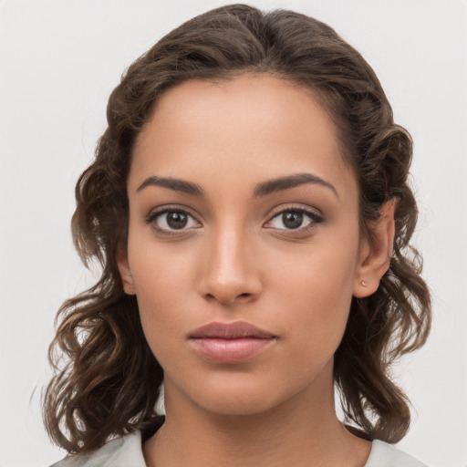 Neutral white young-adult female with medium  brown hair and brown eyes