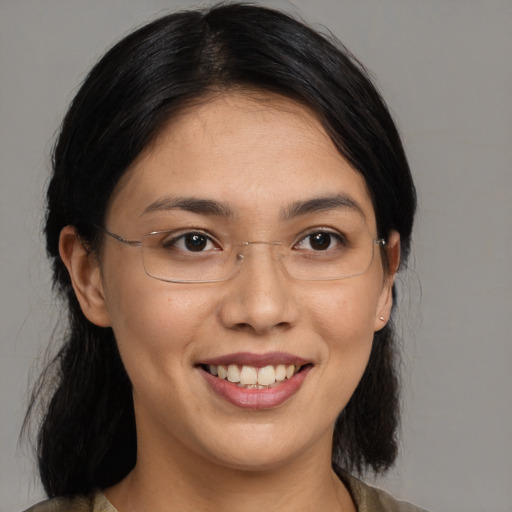 Joyful asian young-adult female with medium  black hair and brown eyes