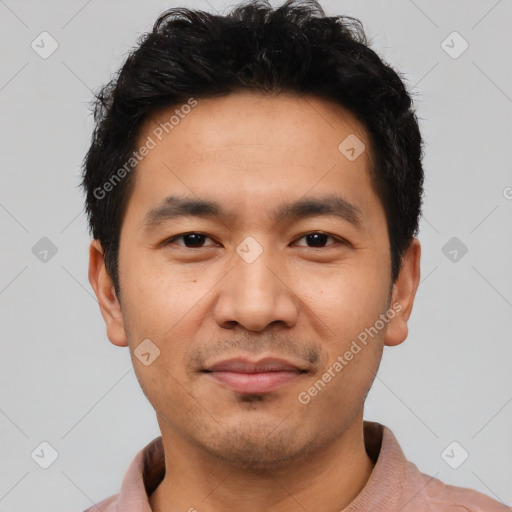 Joyful asian young-adult male with short  black hair and brown eyes