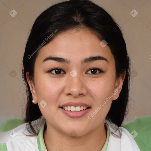 Joyful latino young-adult female with medium  brown hair and brown eyes