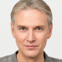 Joyful white adult male with short  brown hair and grey eyes