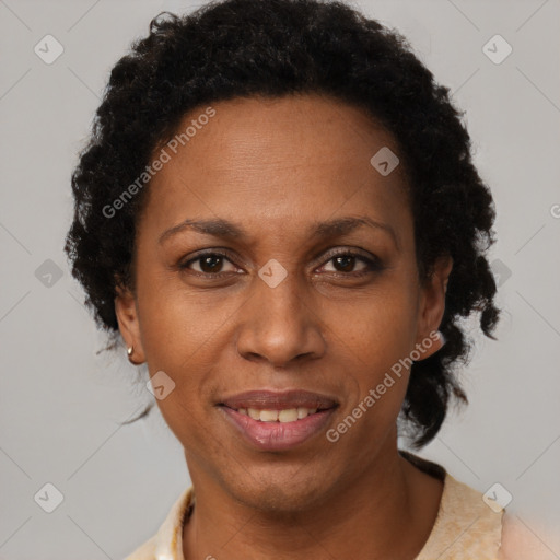 Joyful black adult female with short  brown hair and brown eyes