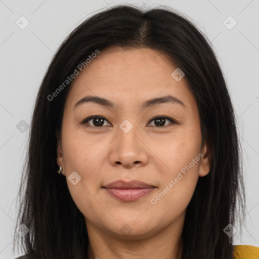 Joyful asian young-adult female with long  brown hair and brown eyes