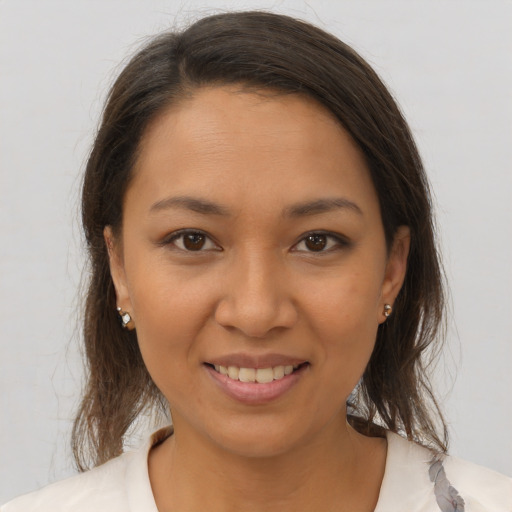 Joyful white young-adult female with medium  brown hair and brown eyes