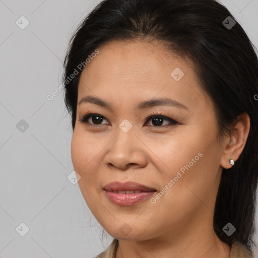 Joyful asian young-adult female with long  brown hair and brown eyes