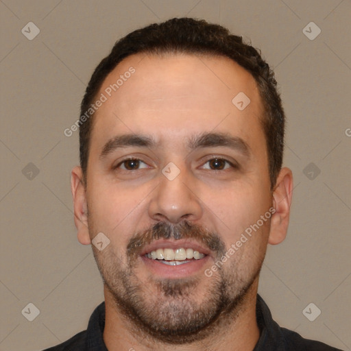 Joyful white young-adult male with short  black hair and brown eyes