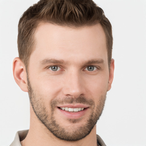 Joyful white young-adult male with short  brown hair and brown eyes