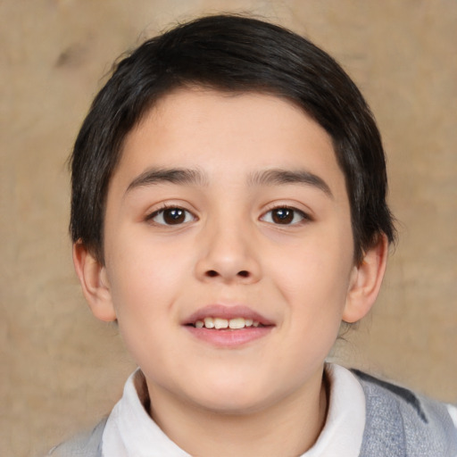 Joyful white child male with medium  brown hair and brown eyes