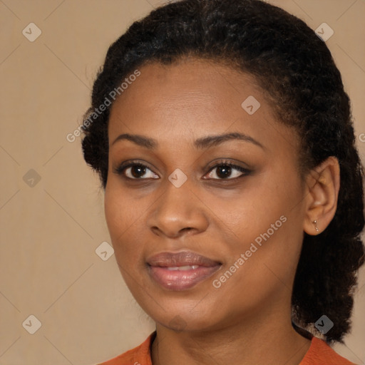 Joyful black young-adult female with medium  brown hair and brown eyes