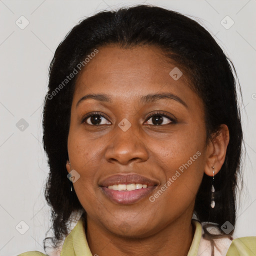 Joyful black adult female with medium  brown hair and brown eyes