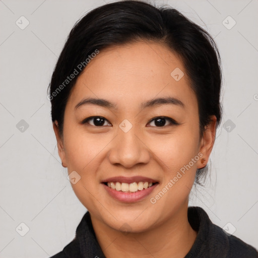 Joyful asian young-adult female with medium  black hair and brown eyes