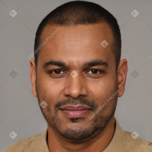 Joyful latino adult male with short  brown hair and brown eyes