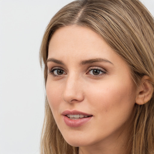 Neutral white young-adult female with long  brown hair and brown eyes