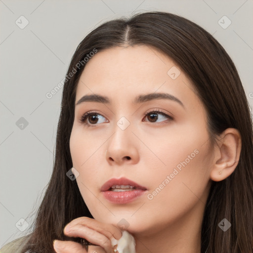 Neutral white young-adult female with long  brown hair and brown eyes