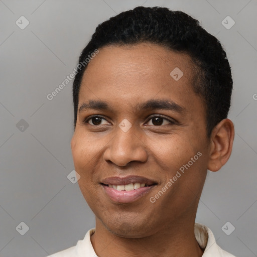 Joyful black young-adult male with short  black hair and brown eyes