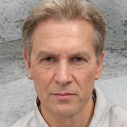 Joyful white middle-aged male with short  brown hair and brown eyes