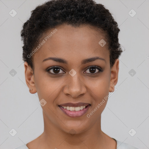 Joyful black young-adult female with short  brown hair and brown eyes