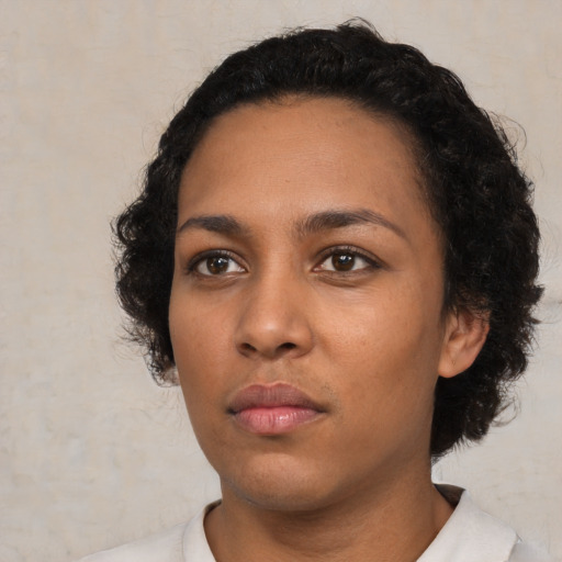 Neutral black young-adult female with short  black hair and brown eyes
