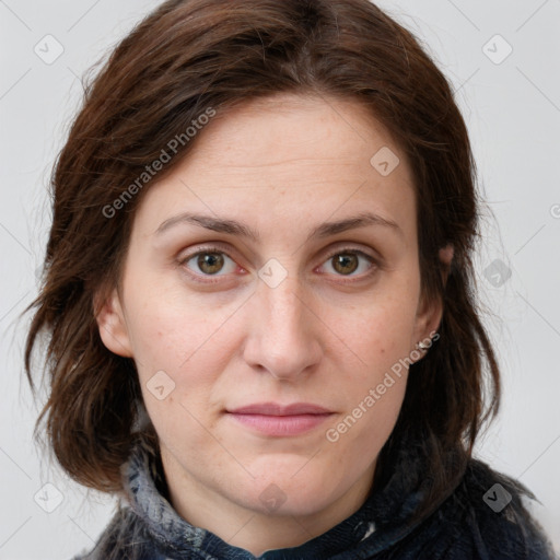 Joyful white young-adult female with medium  brown hair and green eyes