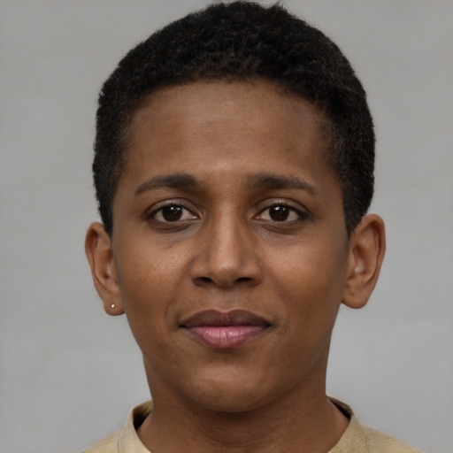 Joyful black young-adult female with short  brown hair and brown eyes