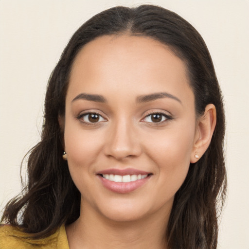 Joyful white young-adult female with long  brown hair and brown eyes