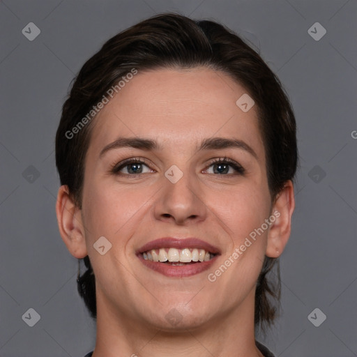 Joyful white young-adult female with medium  brown hair and grey eyes