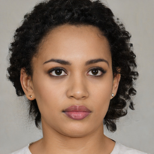 Neutral latino young-adult female with medium  black hair and brown eyes