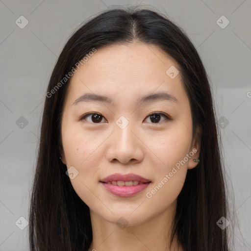 Joyful asian young-adult female with long  brown hair and brown eyes