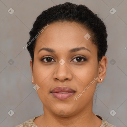 Joyful black young-adult female with short  black hair and brown eyes