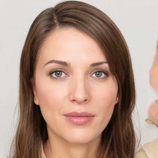 Neutral white young-adult female with long  brown hair and brown eyes