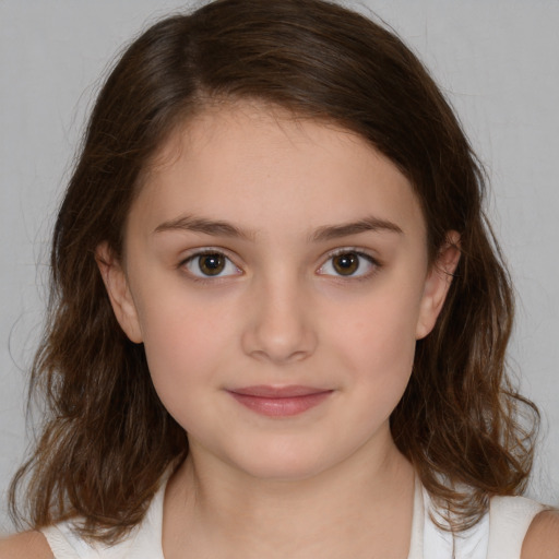 Joyful white child female with medium  brown hair and brown eyes