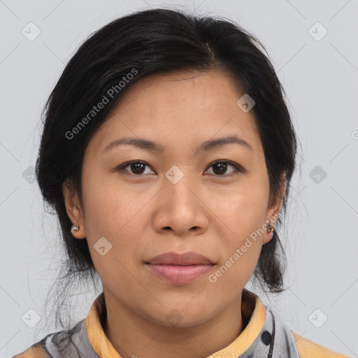 Joyful asian adult female with medium  brown hair and brown eyes