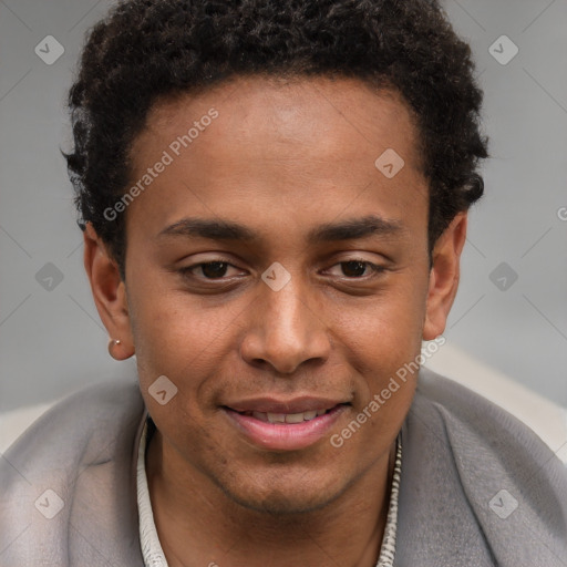 Joyful black young-adult male with short  brown hair and brown eyes