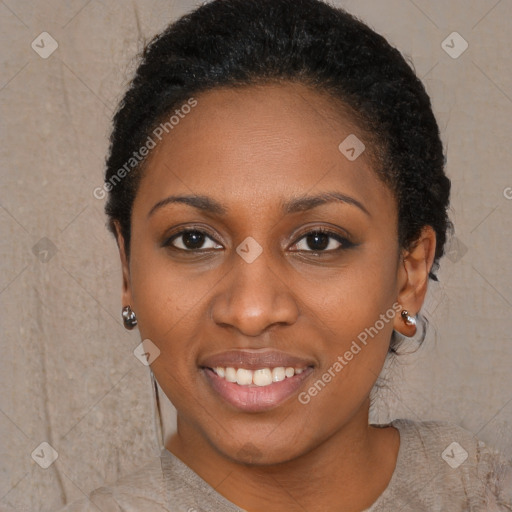 Joyful black young-adult female with short  black hair and brown eyes