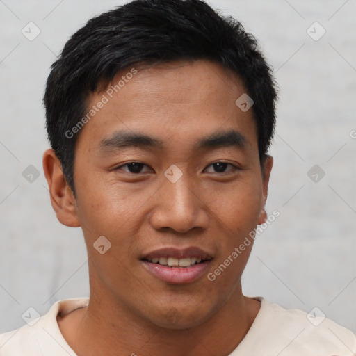 Joyful asian young-adult male with short  black hair and brown eyes