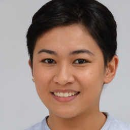 Joyful asian young-adult female with short  brown hair and brown eyes