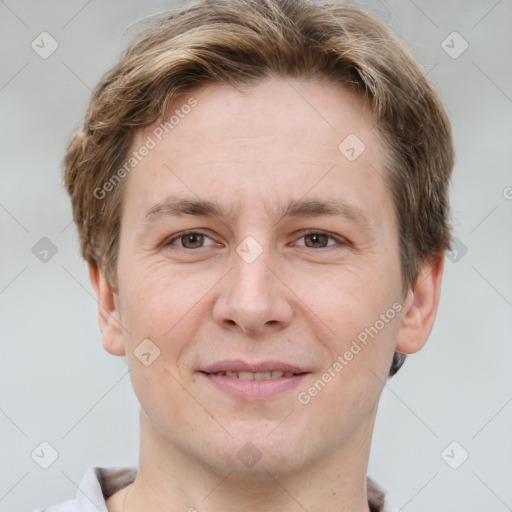 Joyful white adult male with short  brown hair and grey eyes