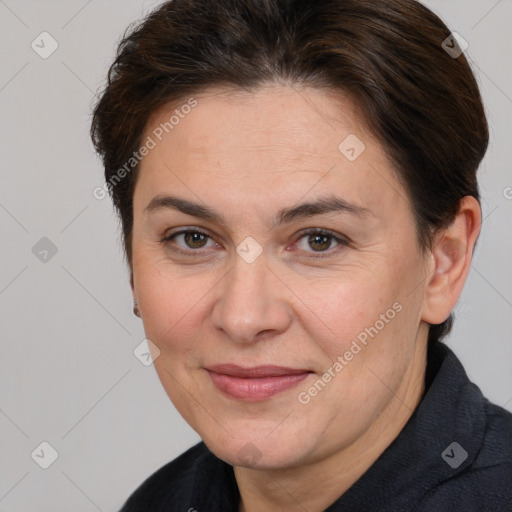 Joyful white adult female with short  brown hair and brown eyes