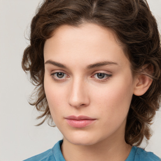 Neutral white young-adult female with medium  brown hair and brown eyes