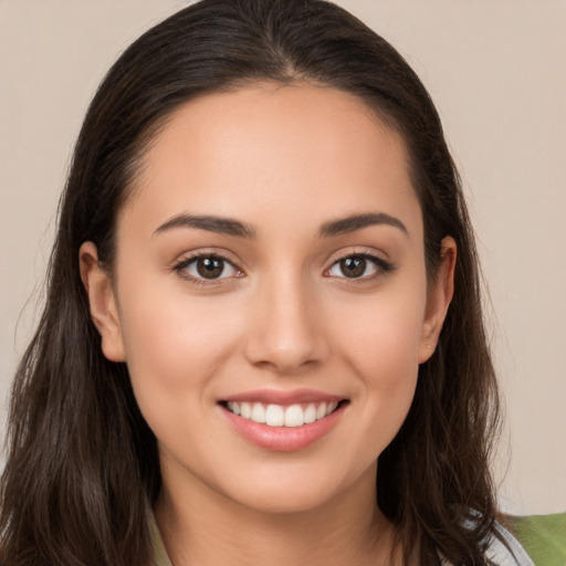 Joyful white young-adult female with long  brown hair and brown eyes