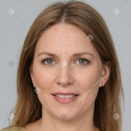 Joyful white adult female with medium  brown hair and grey eyes