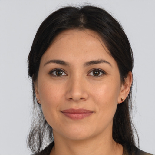 Joyful latino young-adult female with medium  brown hair and brown eyes