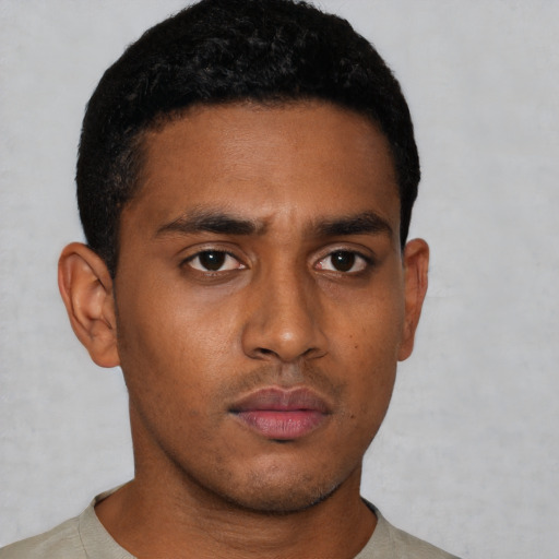 Neutral latino young-adult male with short  brown hair and brown eyes