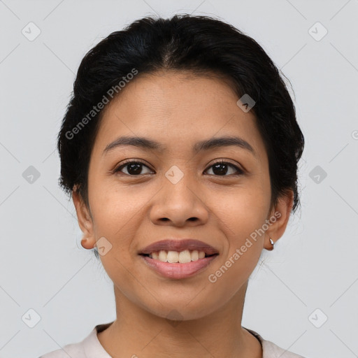 Joyful latino young-adult female with short  brown hair and brown eyes