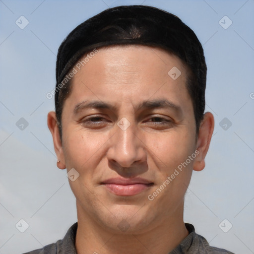 Joyful white adult male with short  brown hair and brown eyes