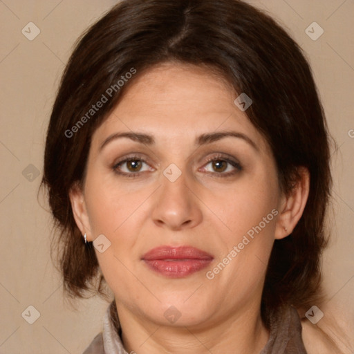 Joyful white adult female with medium  brown hair and brown eyes