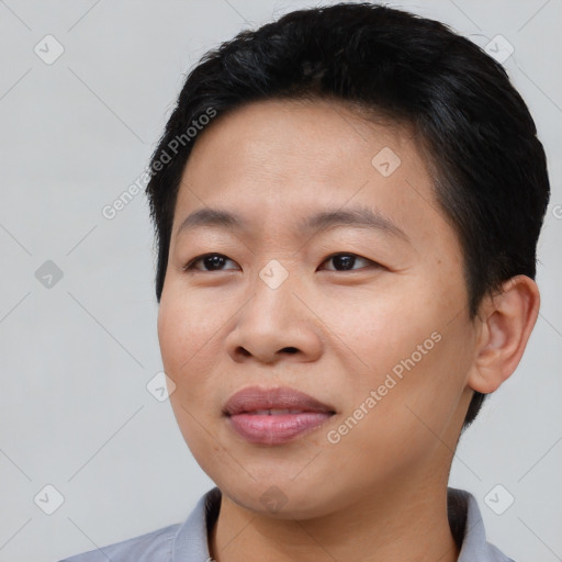 Joyful asian young-adult male with short  black hair and brown eyes