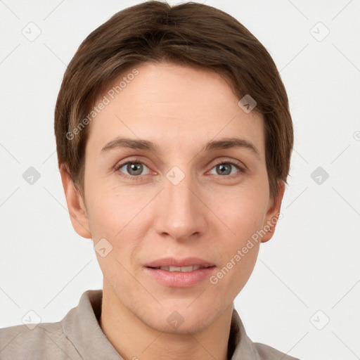 Joyful white young-adult female with short  brown hair and grey eyes