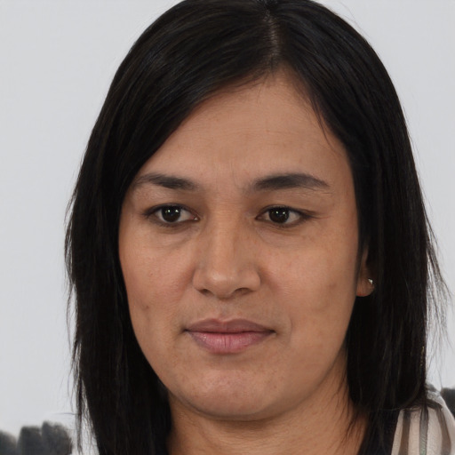 Joyful asian young-adult female with long  brown hair and brown eyes